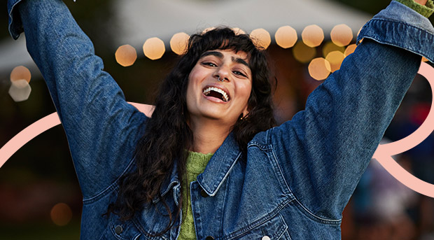 A woman celebrates maintaining good habits.